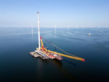 A transport ship and crane. Photo by corlaffra/Shutterstock.