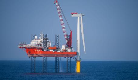 An offshore wind turbine under construction in the North Sea. Photo by DJ Mattaar/Shutterstock. 